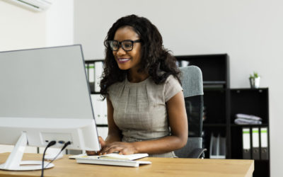 Happy African American Business Woman Using Computer
